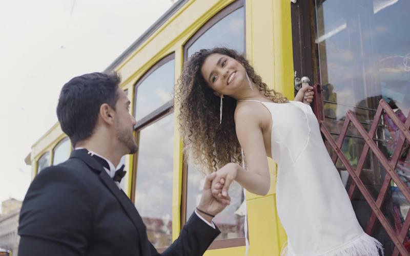 Couple holding hands and smiling, symbolizing how to learn healthy love in a balanced relationship